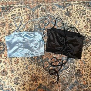 Wore this crop tops like once! They are satin one is baby blue the other black!
